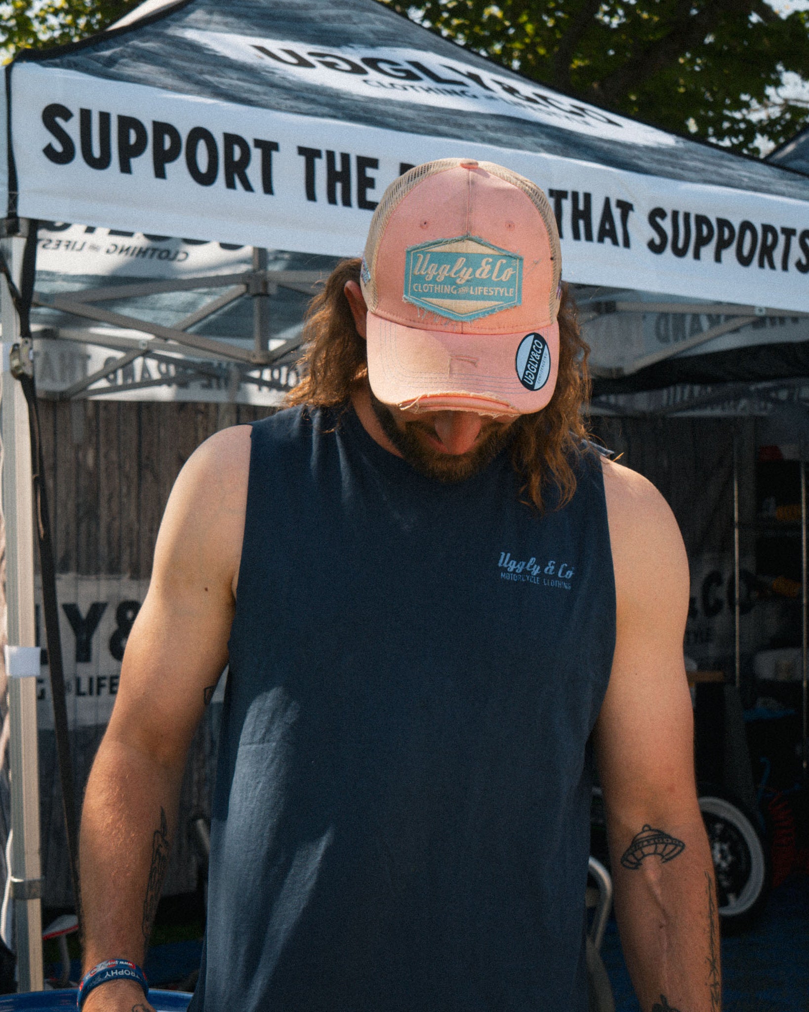 Pastel pink and blue cap worn by Matt Stevenson in a lifestyle photo