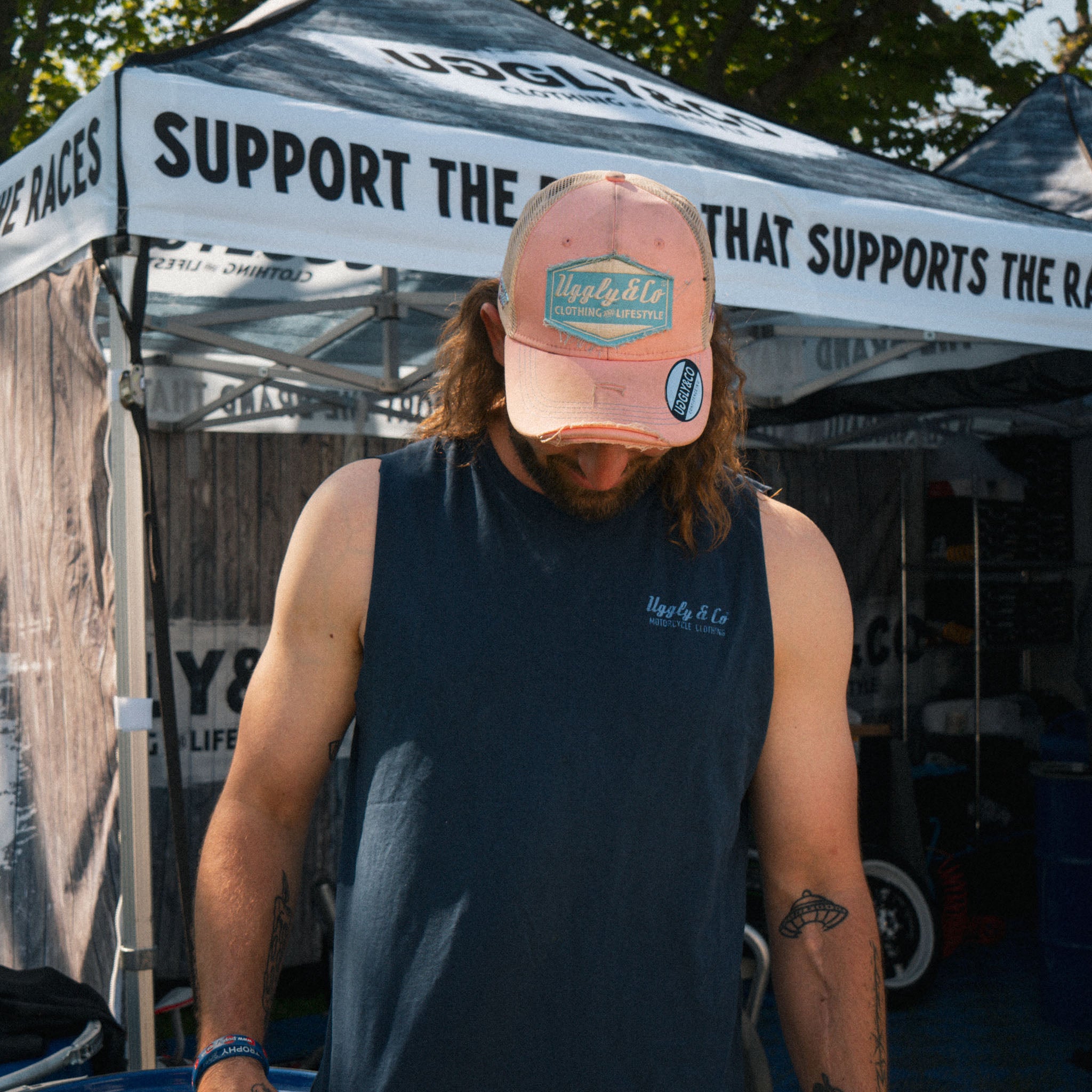 Pastel pink and blue cap worn by Matt Stevenson in a lifestyle photo