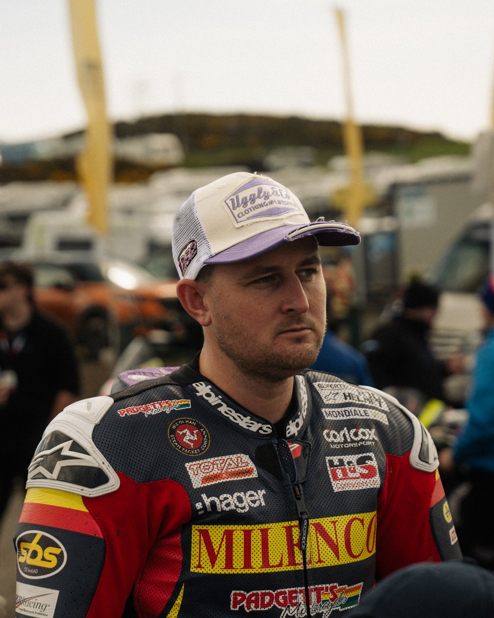 Mitch Rees in a hat at a motorbike event in racing gear