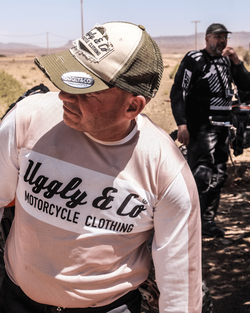 MX rider in a motocross jersey with 'Uggly & Co Motorcycle Clothing' logo