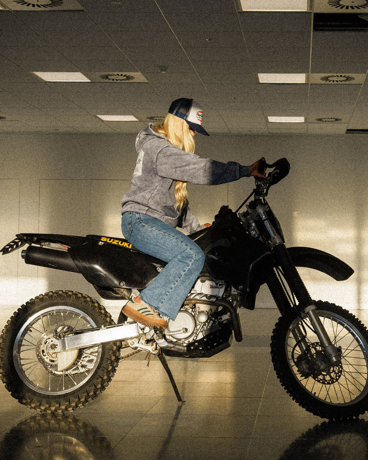 Navy Blue & White Diamond Trucker Hat worn by Abby Marshall on a Suzuki drz