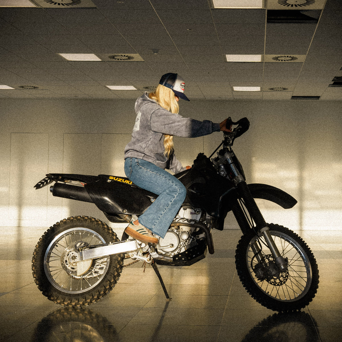 Navy Blue & White Diamond Trucker Hat worn by Abby Marshall on a Suzuki drz