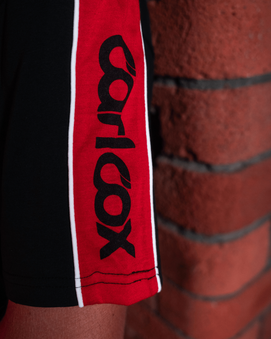 Close up of the sleeve detailon a Carl Cox motorsport and Team Classic Suzuki black and red t-shirt
