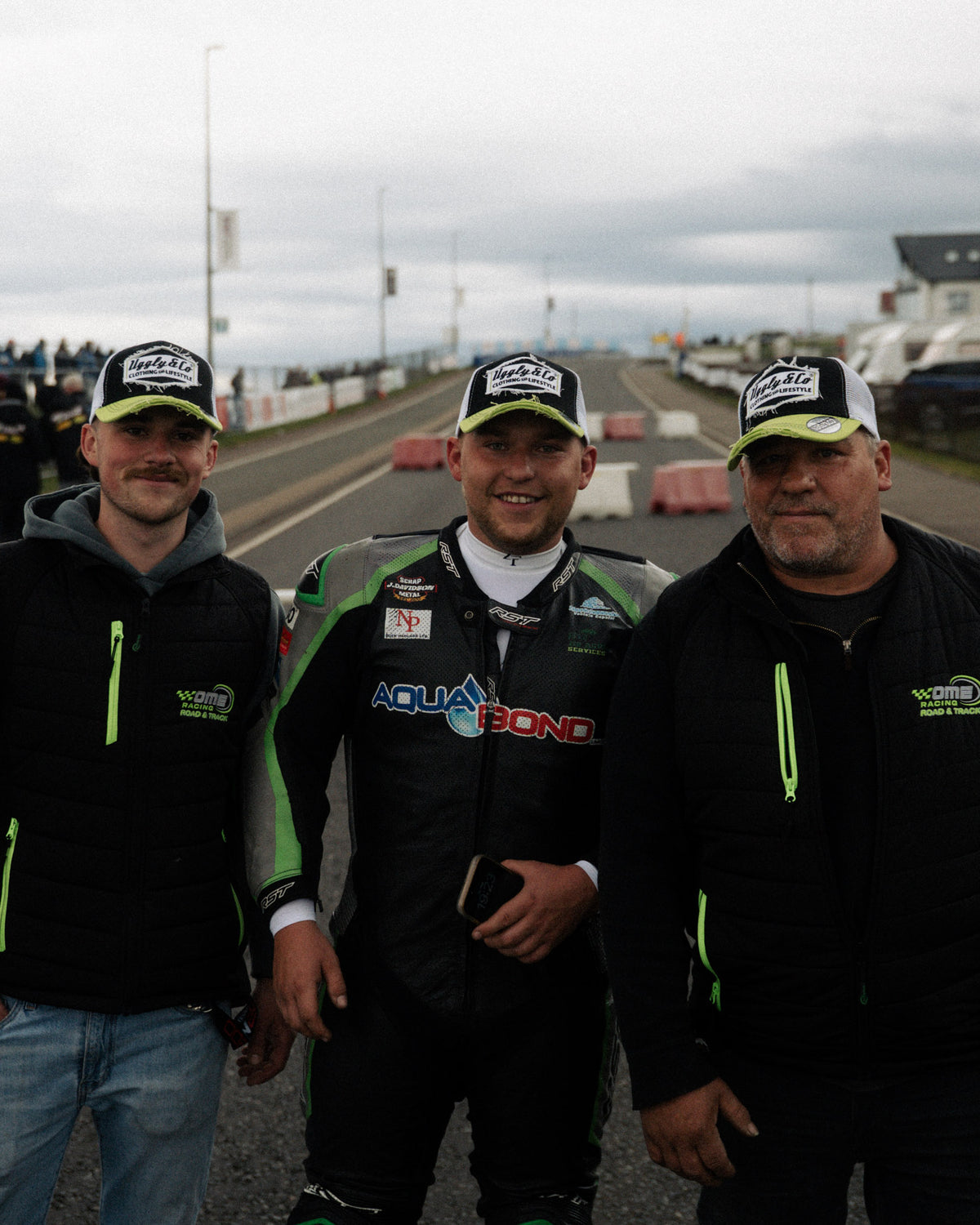motorbike riders wearing black and green trucker hats at the north west 200