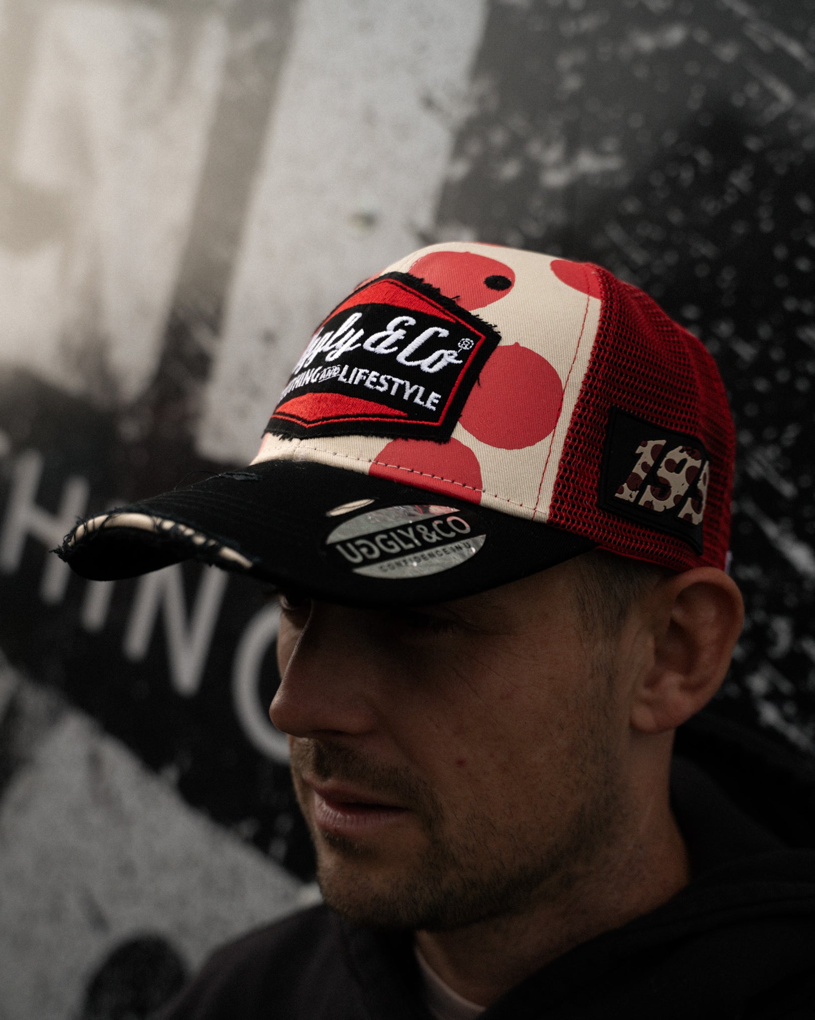 Pierre Yves Bian in red and white trucker hat side profile