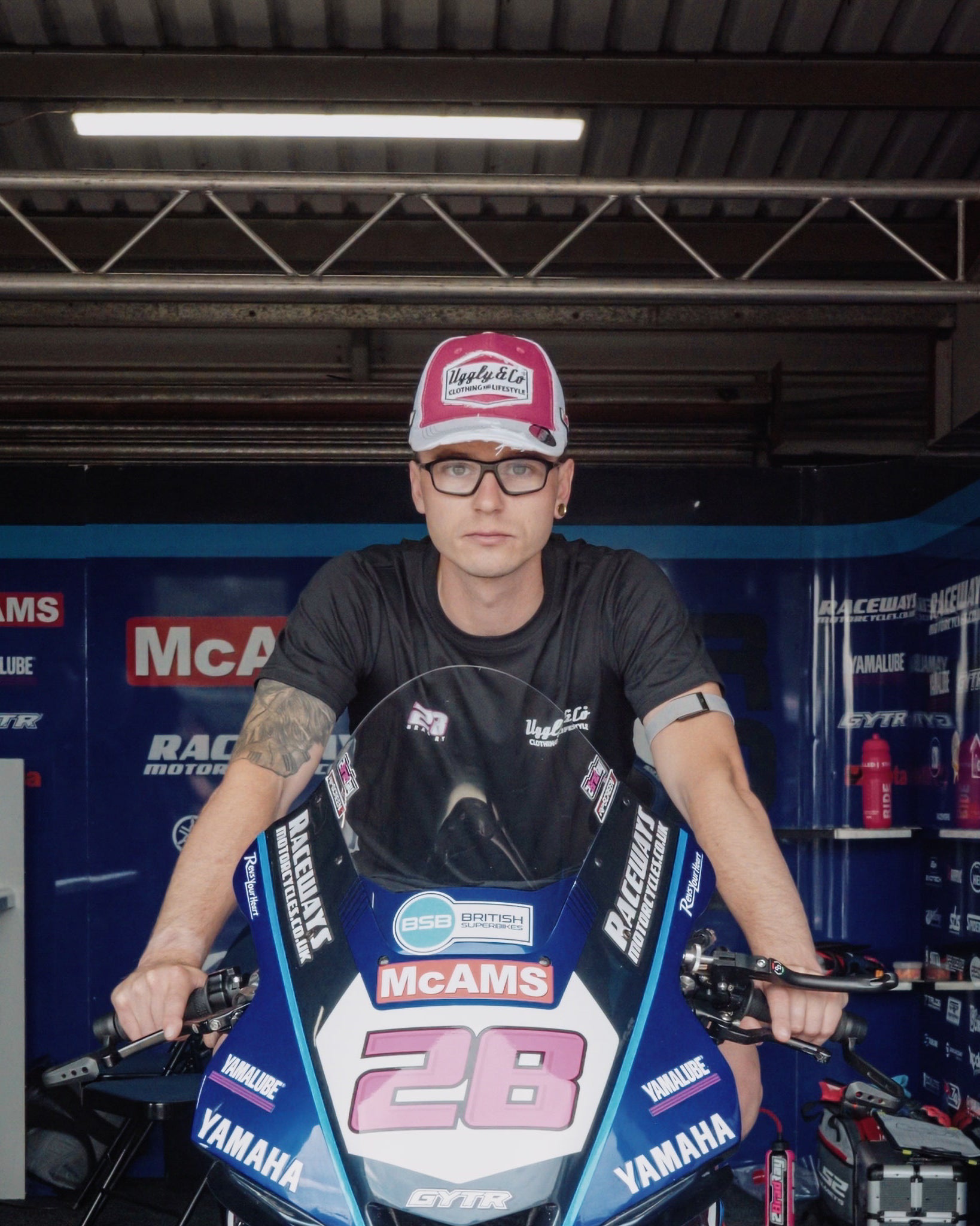 Pink and white Bradley Ray number 28 Diamond trucker hat shown from the front