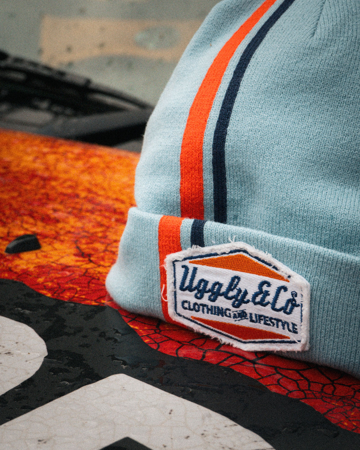 close up shot of the retro diamond light blue and orange beanie