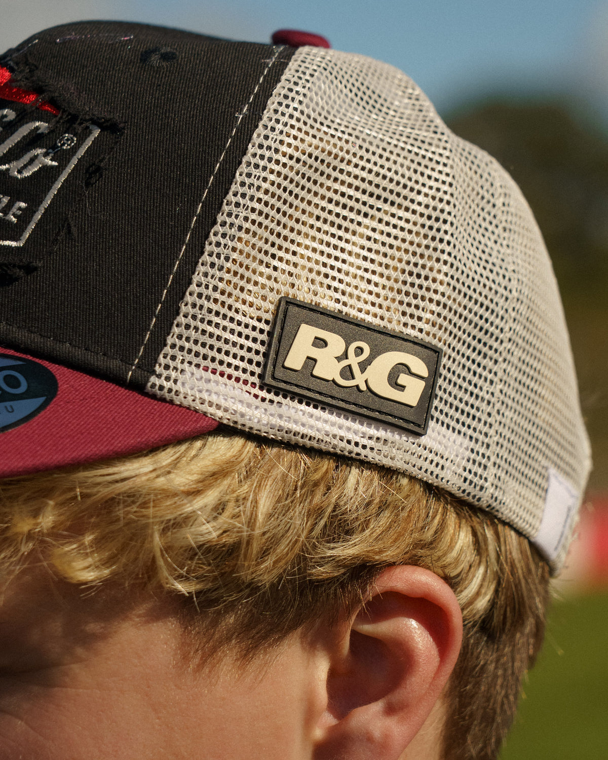 Close-up of the side logo on the R&G Crash Protection Trucker Cap