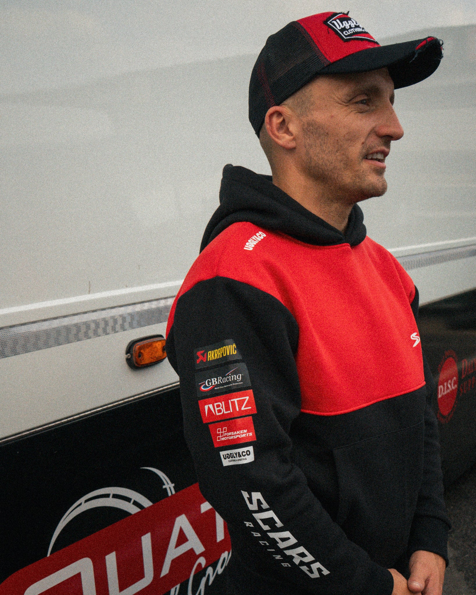 Luke Stapleford wearing a black Scars Racing hoodie in the paddock