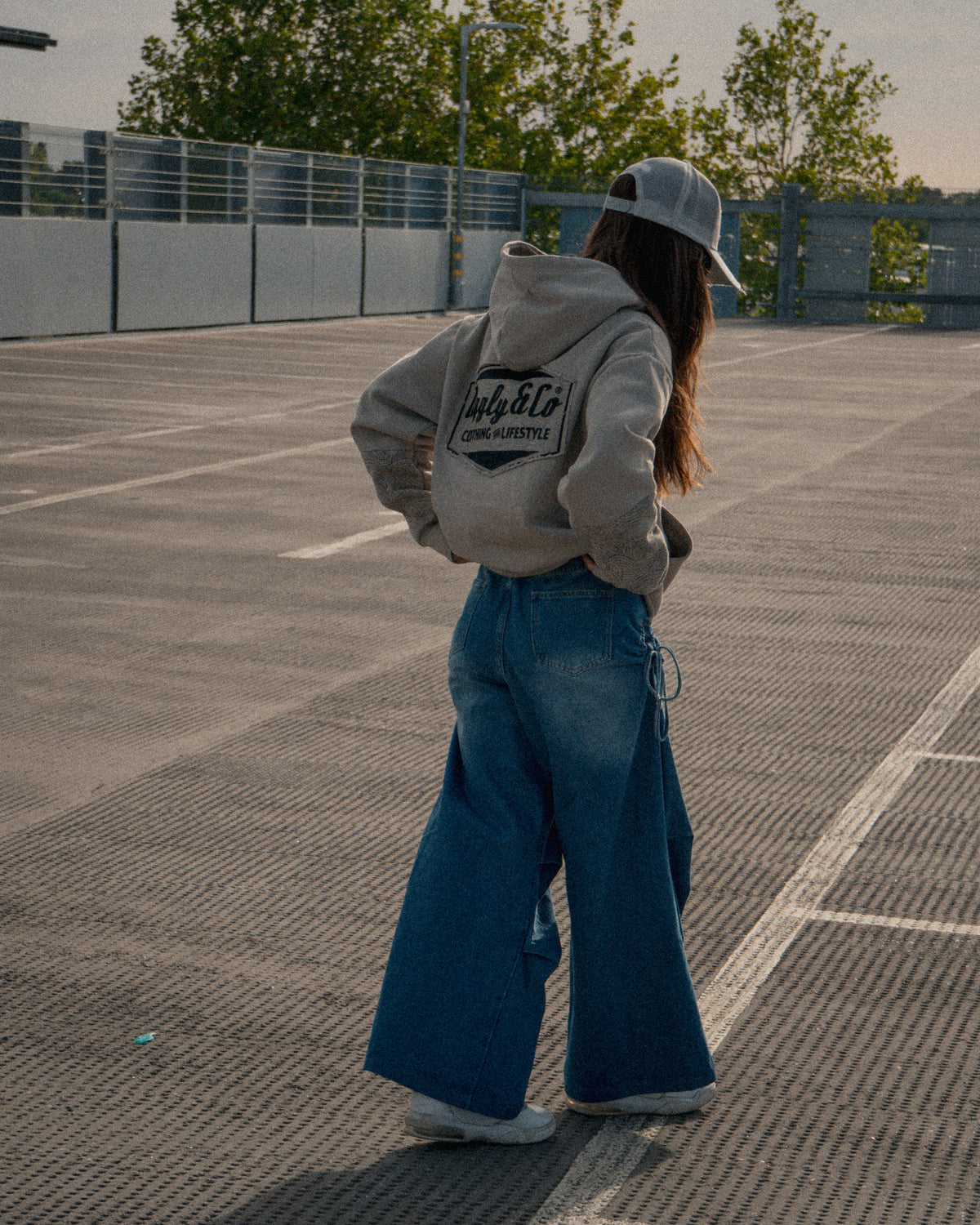 Female fashion styling with the Silver & Grey Diamond Trucker Hat