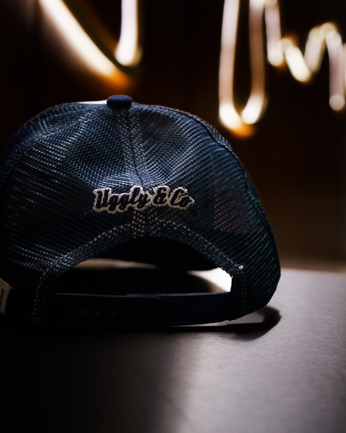 Uggly & Co Navy Blue & White Diamond Trucker Hat back logo