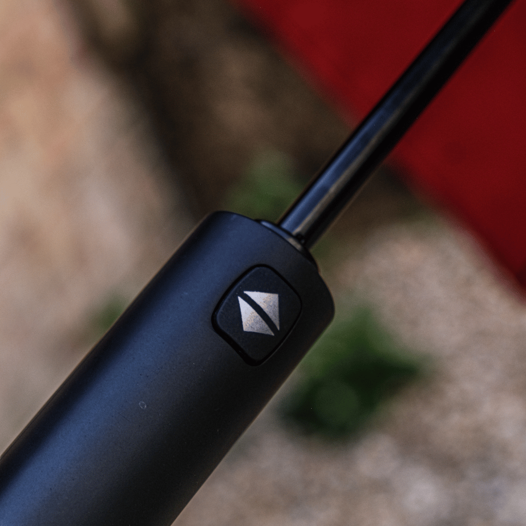 Close up of the black handle of a Milwaukee Tools x Ducati umbrella
