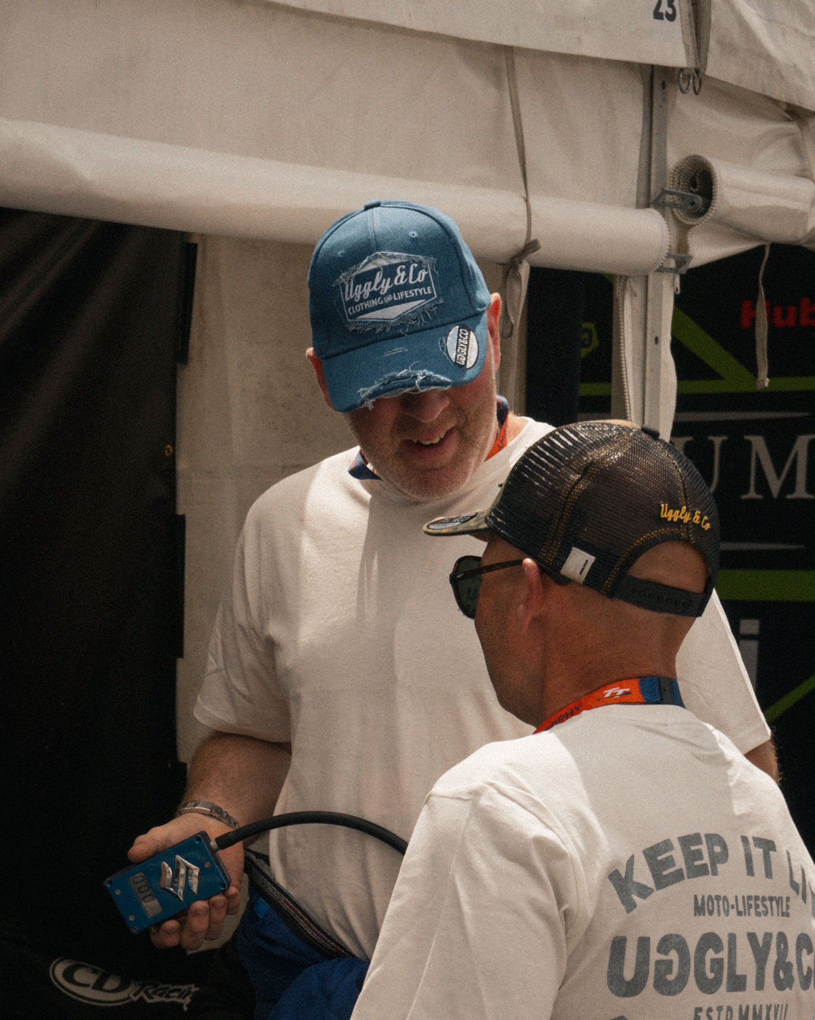 Mechanic wearing the vintage denim Diamond baseball cap in a race environment