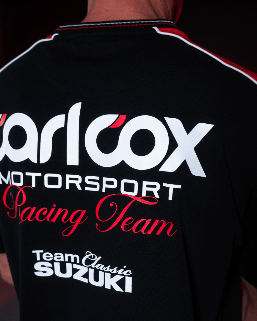 Close up of the back logos on a Carl Cox motorsport and Team Classic Suzuki black and red t-shirt