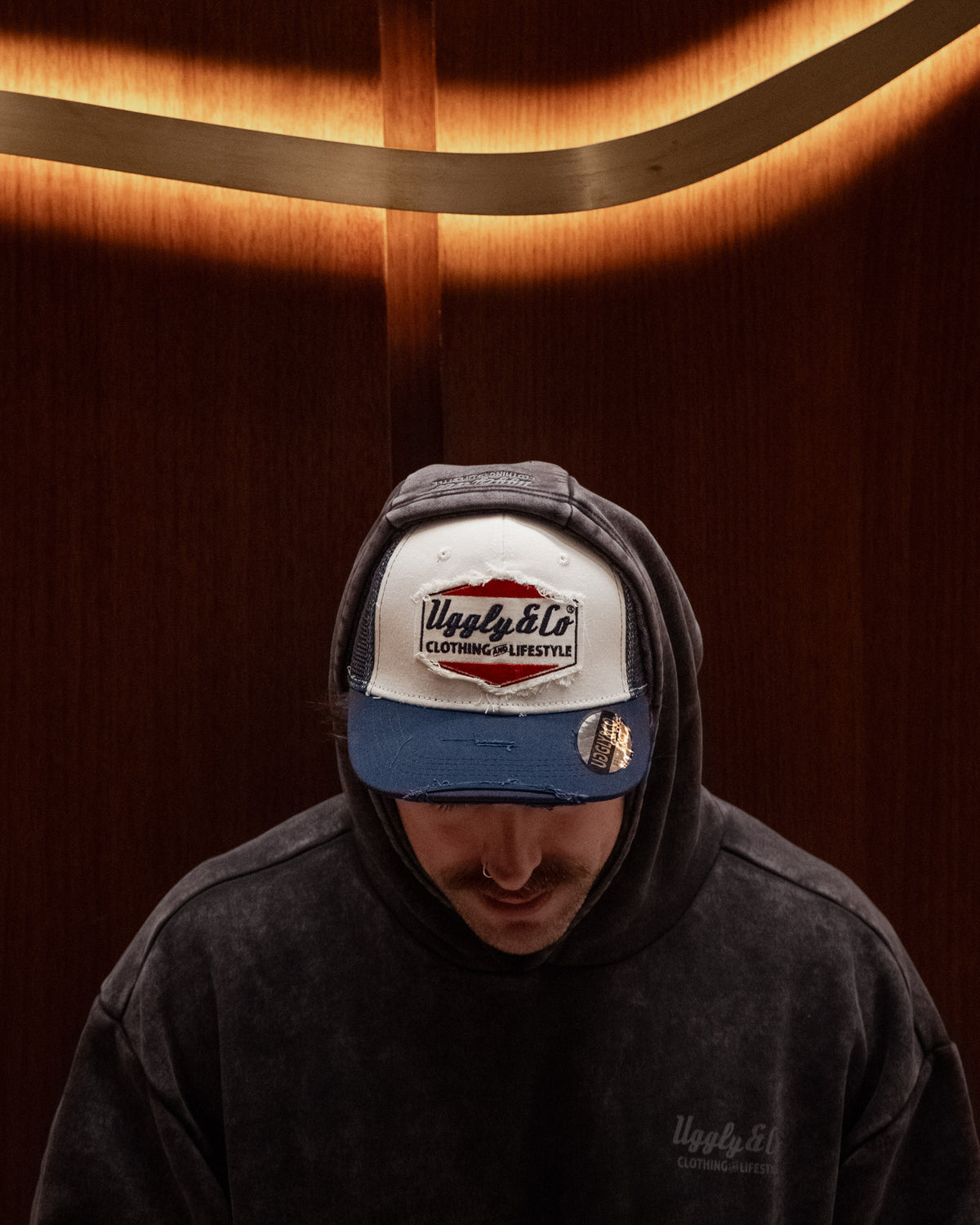 Wendigo wearing the Navy Blue & White Diamond Trucker Hat