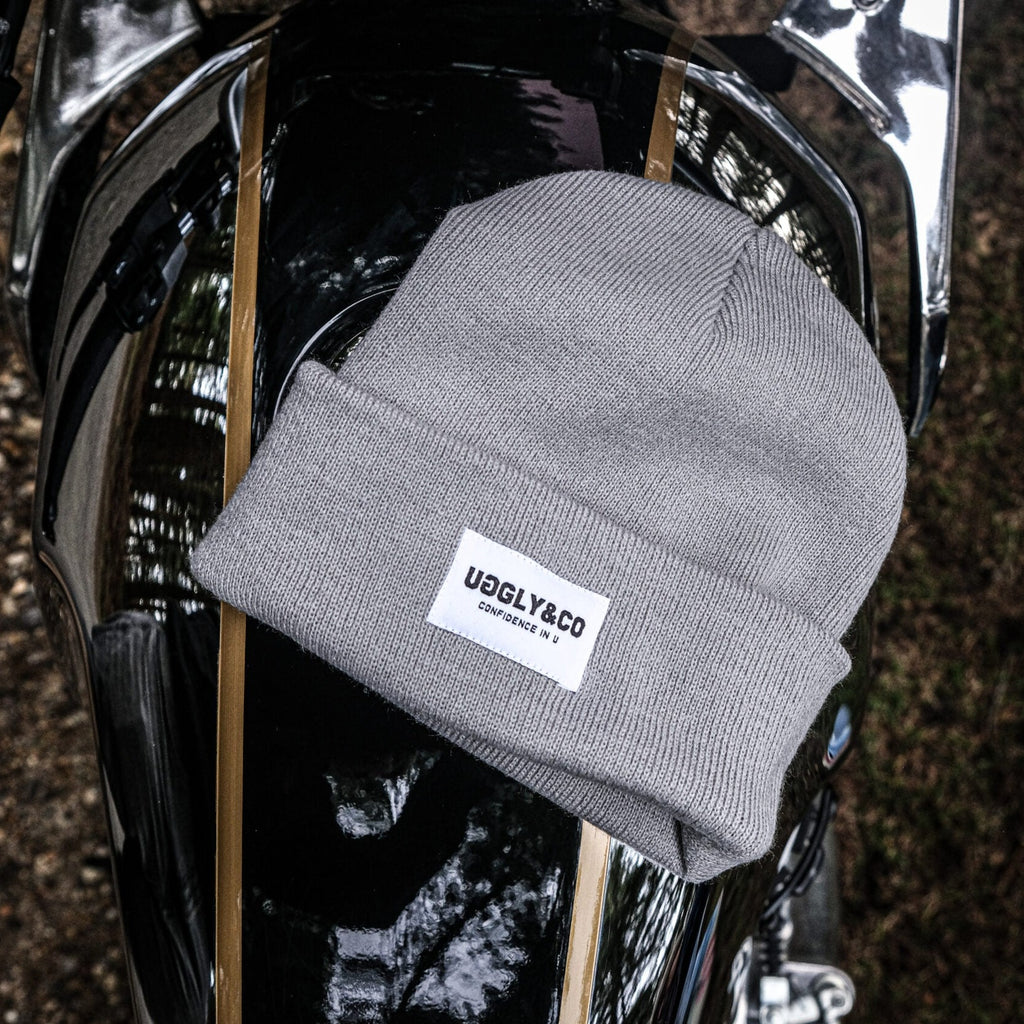 A Uggly&Co light grey heather beanie on the tank of a Royal Enfield on a unique photoshoot with @wreckitwren on instagram