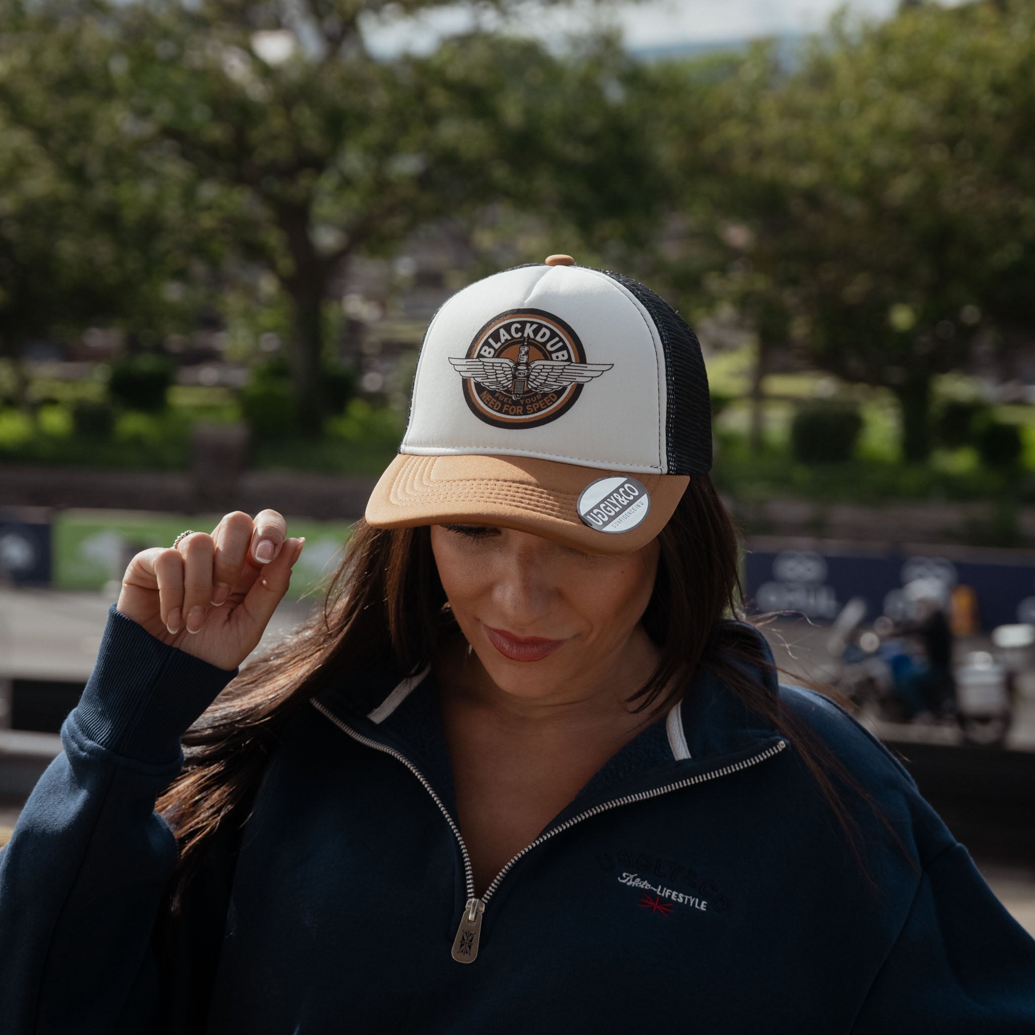 girl pictured at the tt in black dub garage hat