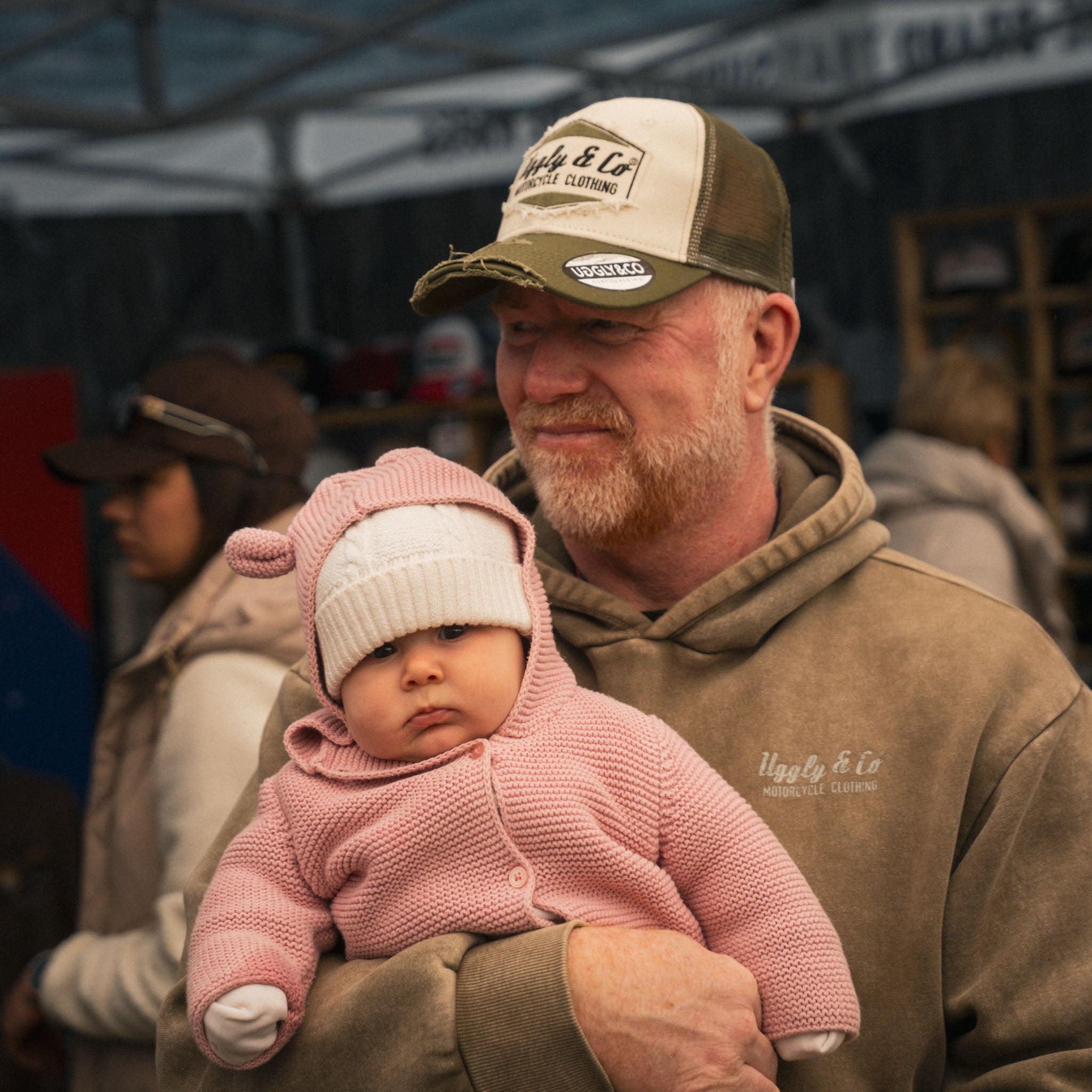 motorsport fan with baby at race event