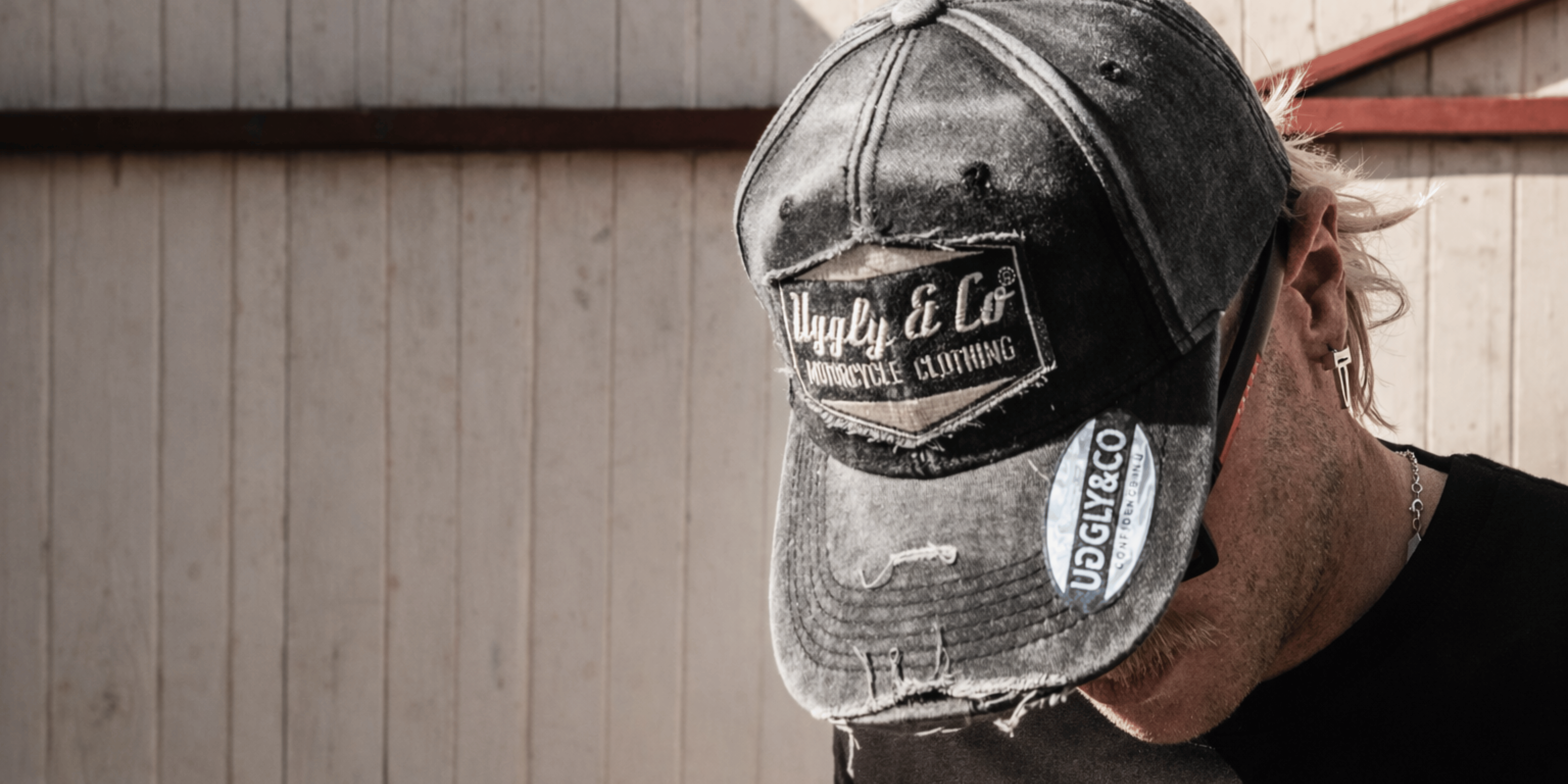 Distressed vintage trucker cap with Uggly & Co Automobile Clothing patch - premium motorsport-inspired headwear