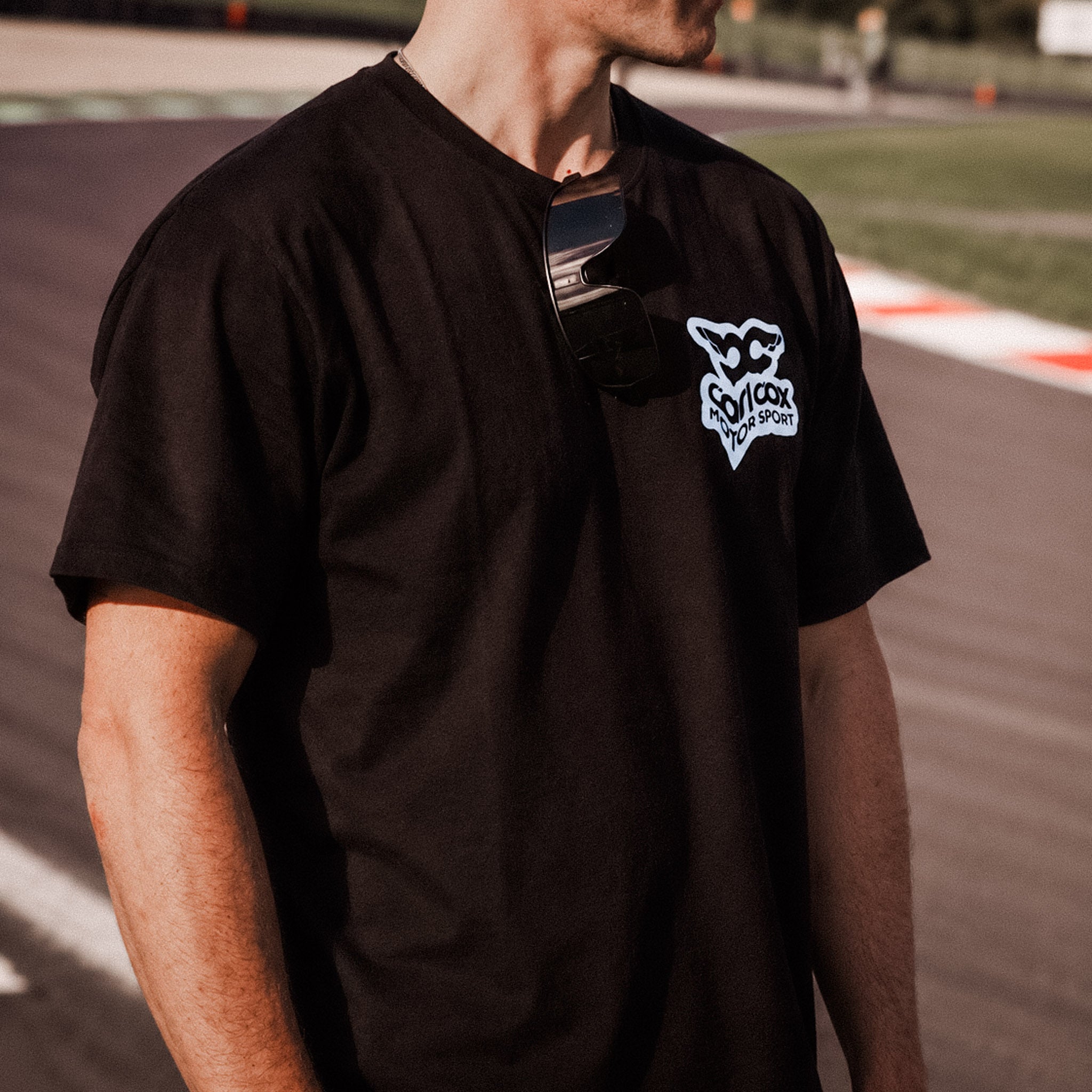 Simon Reid wearing carl cox motorsport t-shirt on track at Donington Park