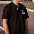 Simon Reid wearing carl cox motorsport t-shirt on track at Donington Park
