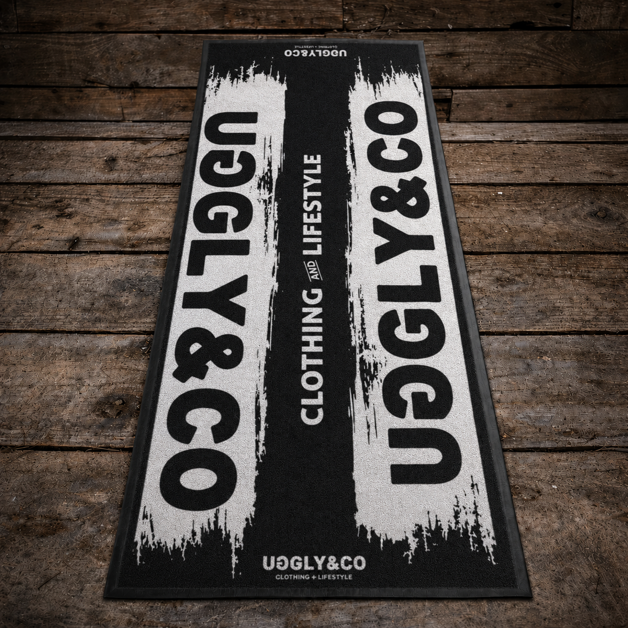 Uggly & Co branded mat on a wooden floor