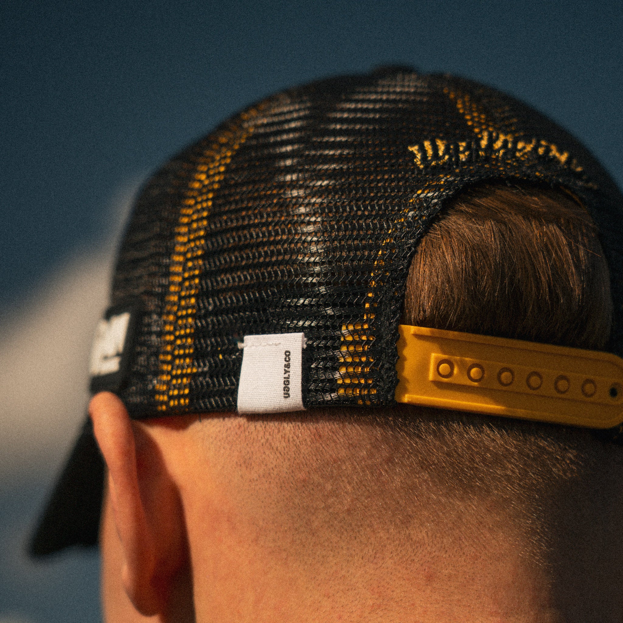 close up detail shot of logos on baths racing cap