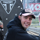 Fenton Seabright at race track smiling, side view
