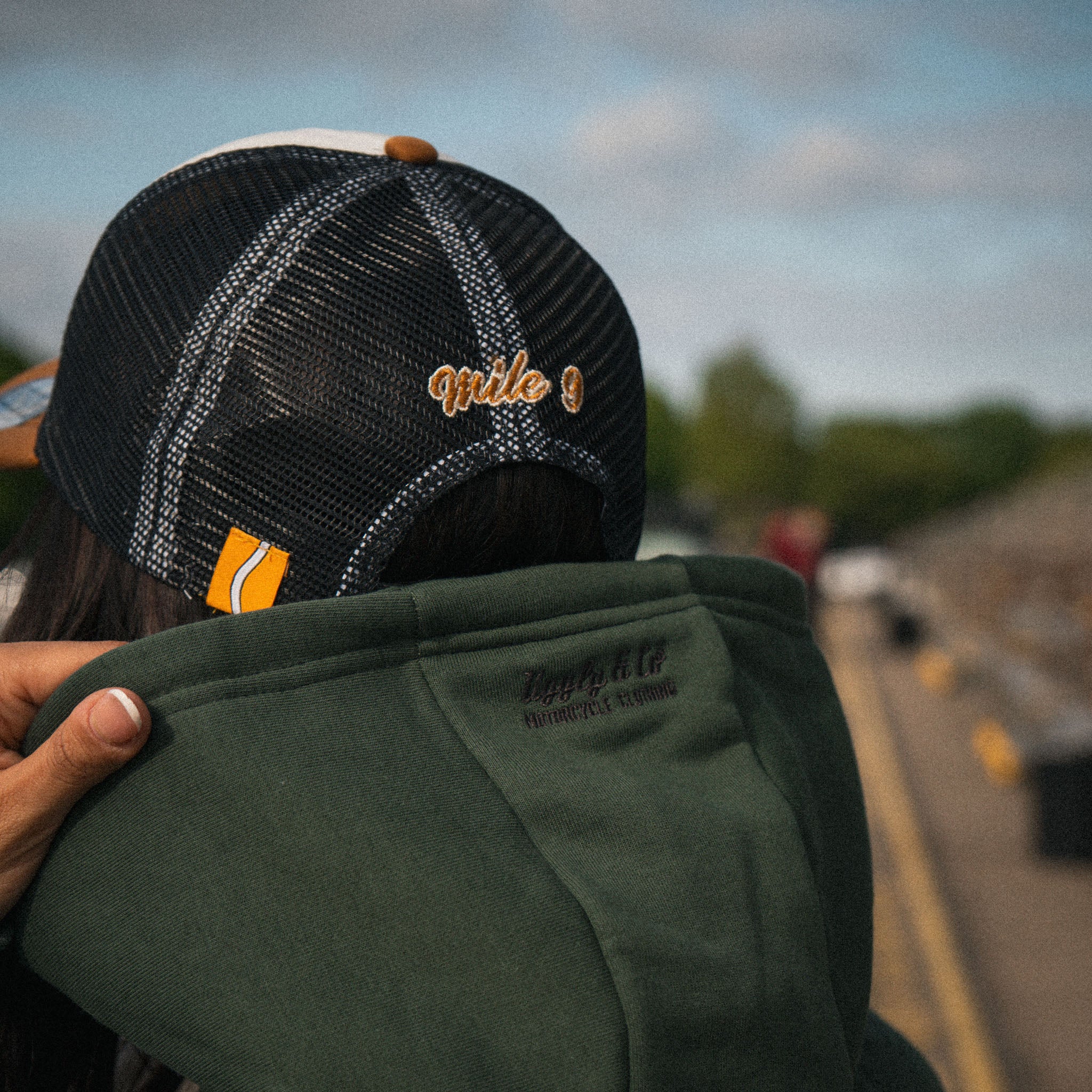 Close up of the Keep It Lit graphic on the green motorsport hoodie