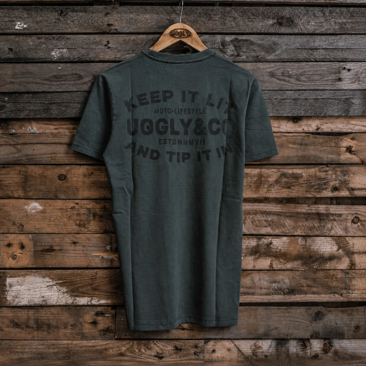 product photo of the uggly and co green keep it lit t shirt rear view