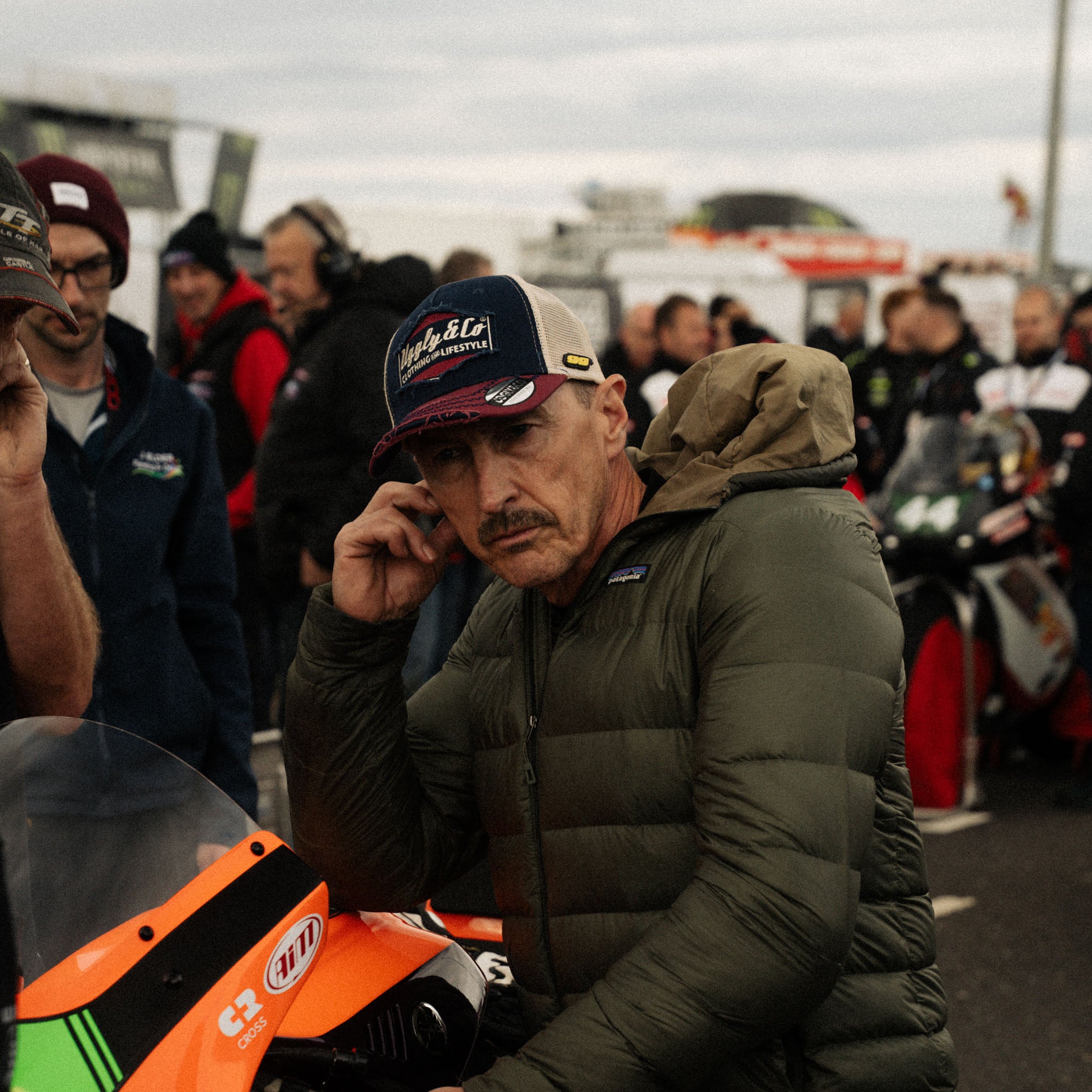 Jeremy McWilliams checking bike on grid of a race track