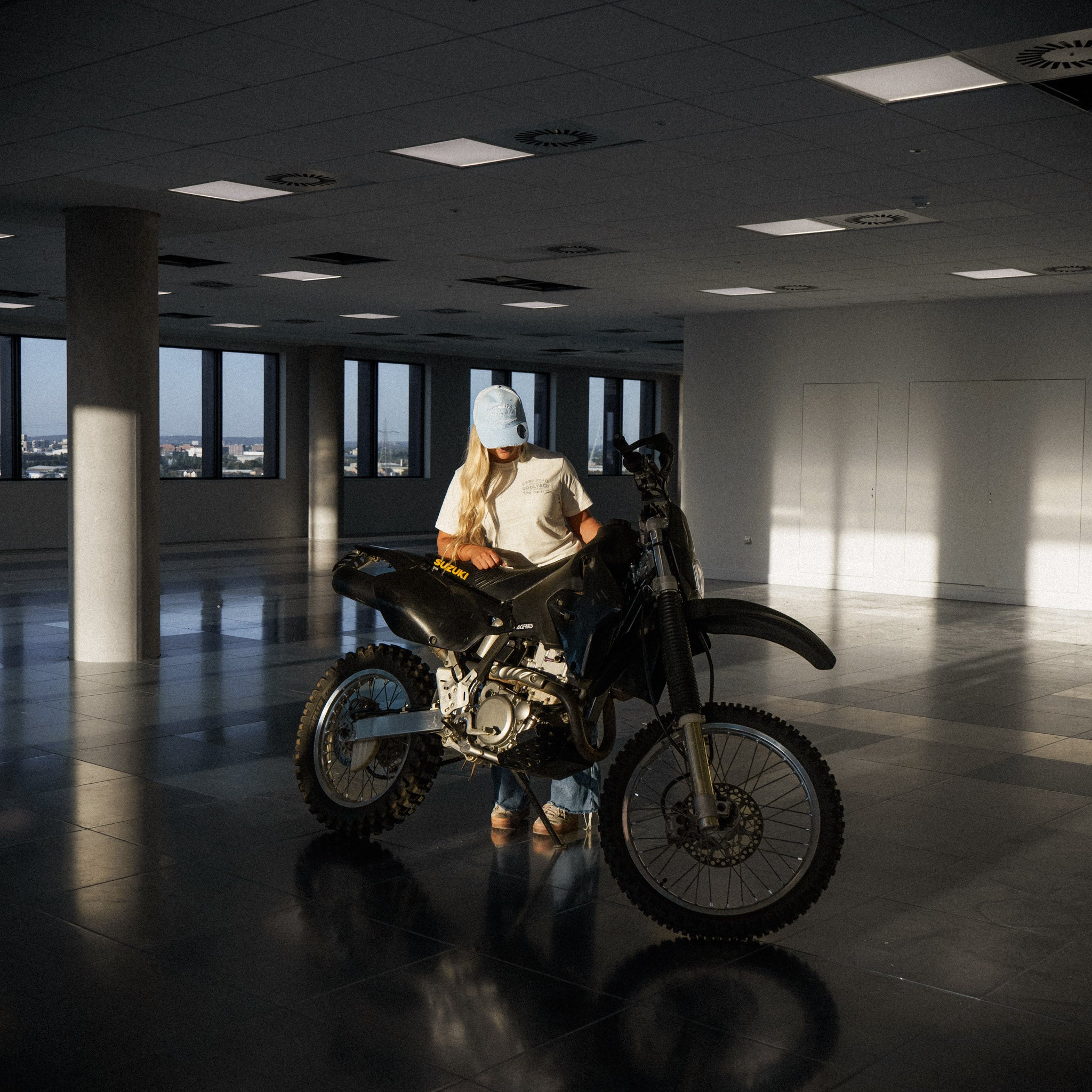 white motorbike tshirt next to motocross bike