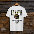Rear view of a Kyle Ryde signature white t-shirt with motorbike helmet, back to back, Ryde and Uggly&Co logos on a wooden background