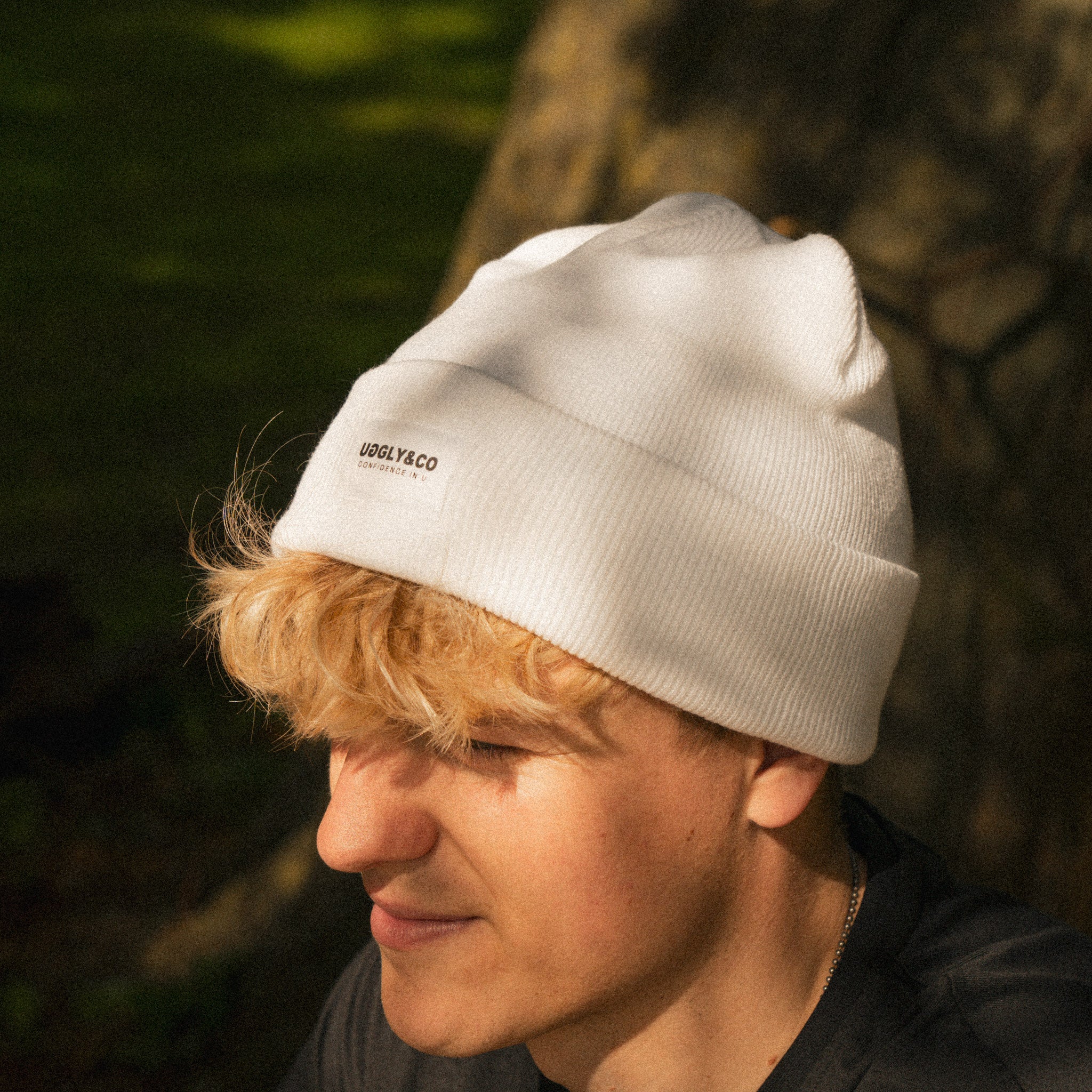 Rhys Irwin modeling white uggly and co beanie