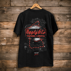 Rear view of an Uggly&Co black t-shirt with commentator Steve Day The Map graphic on the back featuring authentic Isle of Man TT notes on a wooden background