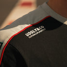 close up shot of uggly and co logo on biota tshirt
