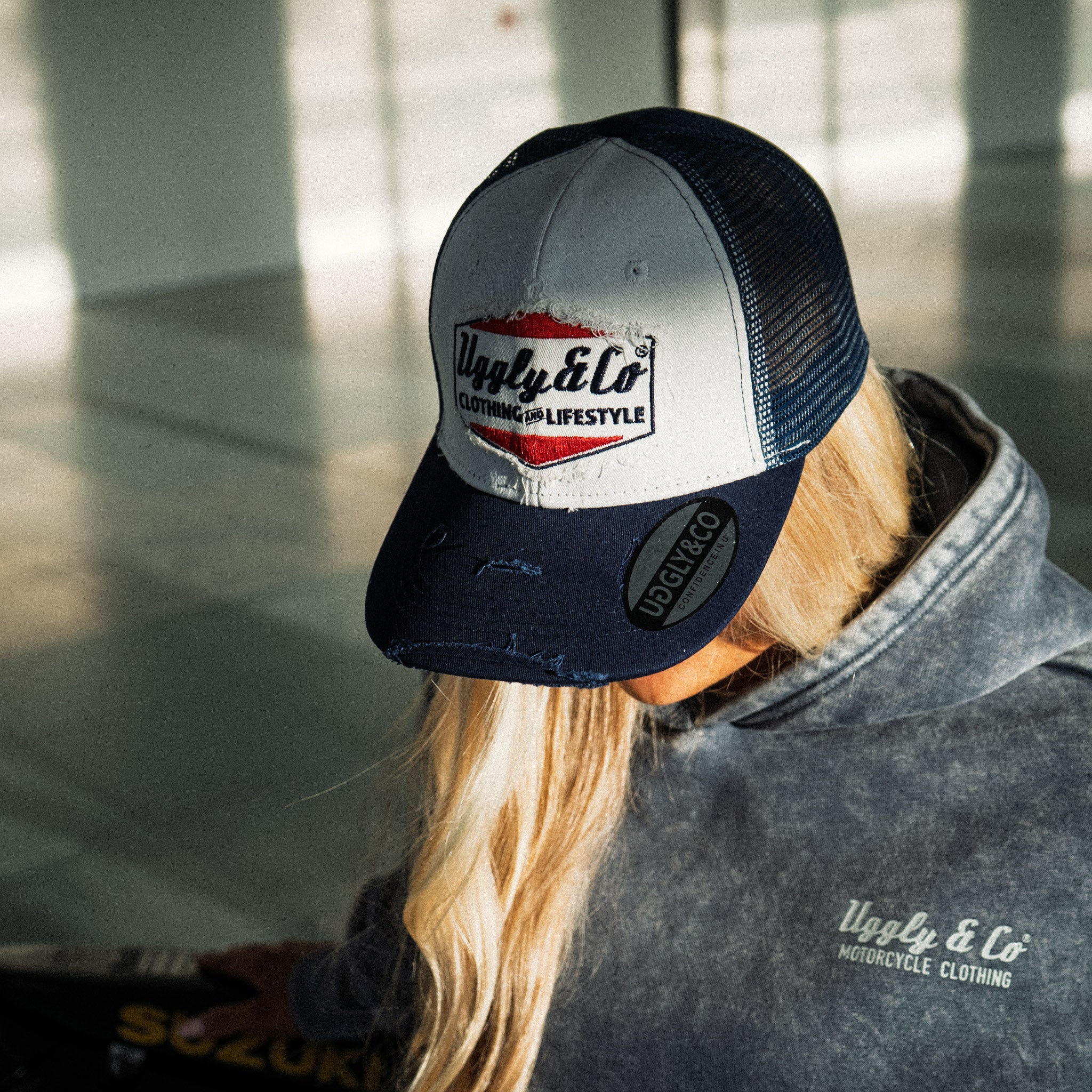 Abby Marshall in the Uggly & Co Navy Blue & White Diamond Trucker Hat