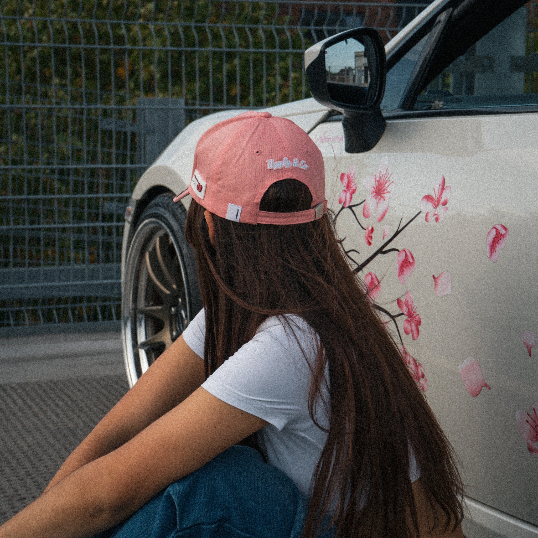 photo showing the rear logo of the uggly and co washed pink vintage cap