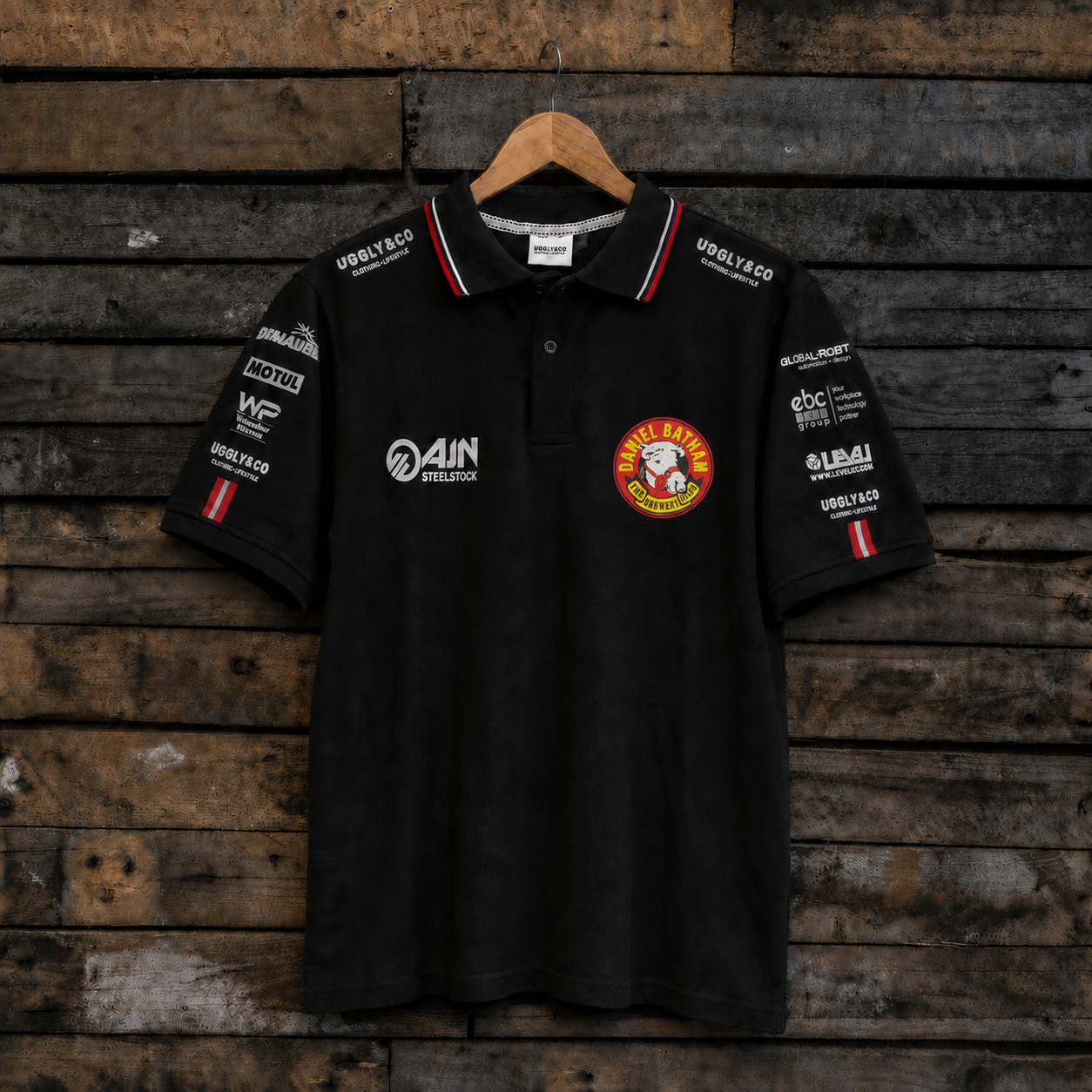 Front view of the Bathams Racing x AJN Steelstock Road Racing Polo featuring team sponsor logos and racing branding.