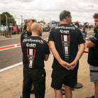 Bathams Racing mechanics wearing branded AJN Steelstock team T-shirts during a race weekend