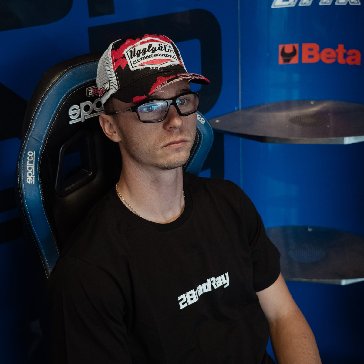 Black Bradley Ray 'Take the Risk' T-Shirt in a McAMS Yamaha motorcycle garage setting