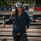 Female model wearing Black Diamond Heavyweight Joggers in a motorcycle race paddock