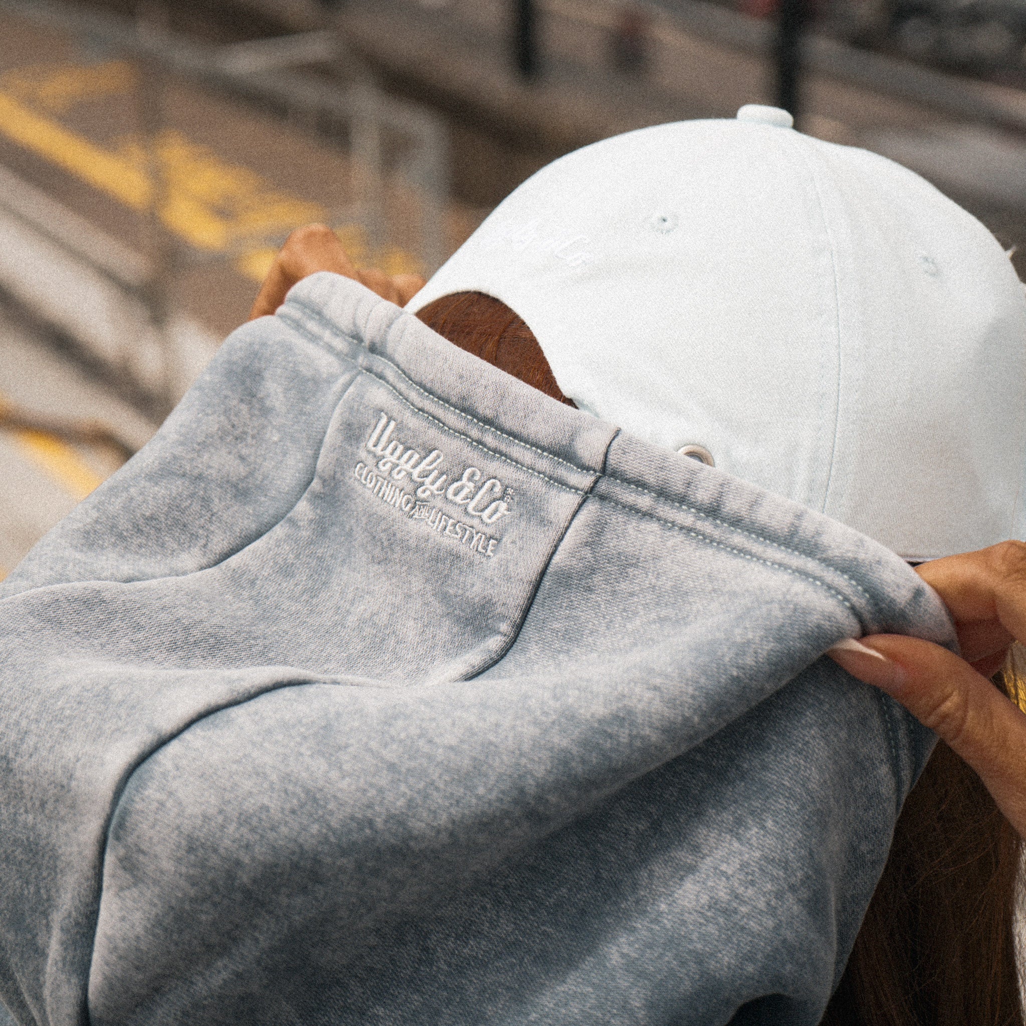 Close-up of the hood and blue acid wash finish on the women’s hoodie.