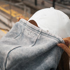 Close-up of the hood and blue acid wash finish on the women’s hoodie.