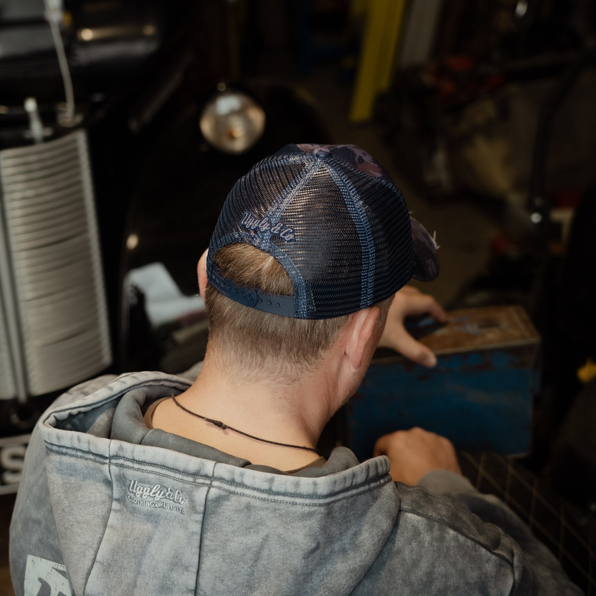 Back view of the Blue Camo Diamond Trucker Hat with mesh panels