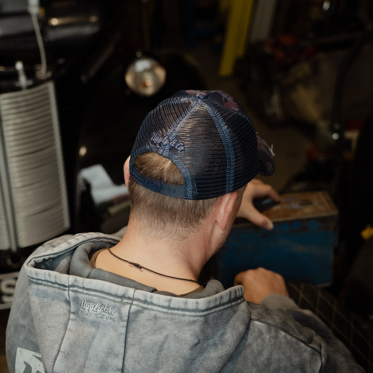 Back view of the Blue Camo Diamond Trucker Hat with mesh panels