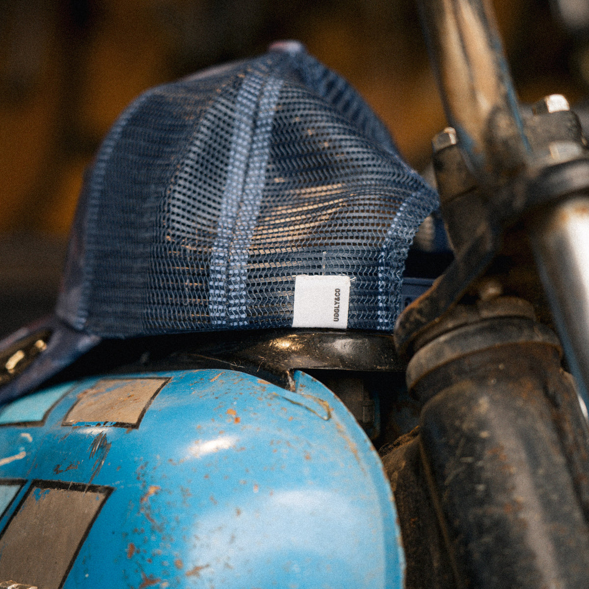 Close up of the Blue Camo Diamond Trucker Hat logo