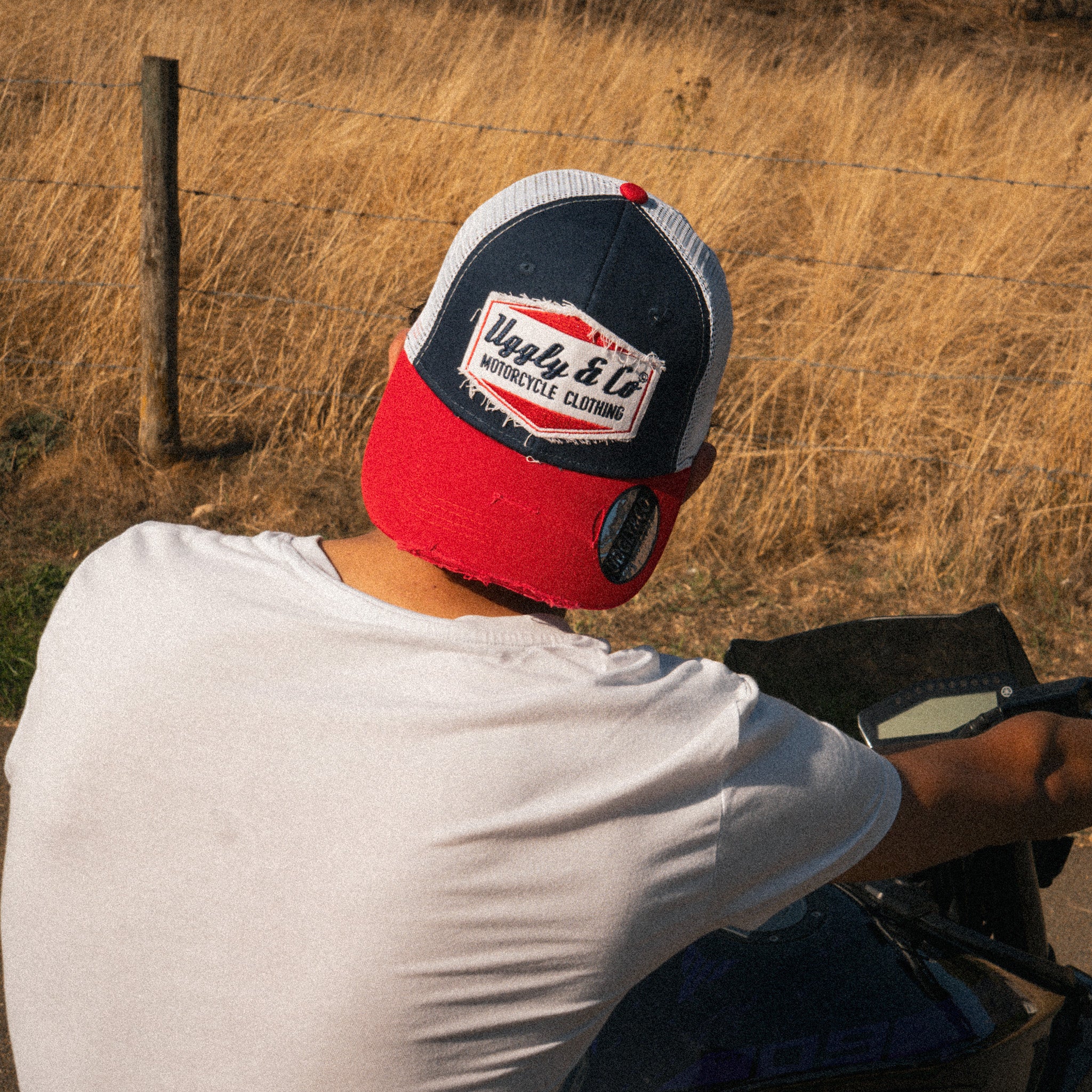 Back view of the Blue and Red Diamond Trucker Hat showing the mesh panels and adjustable closure