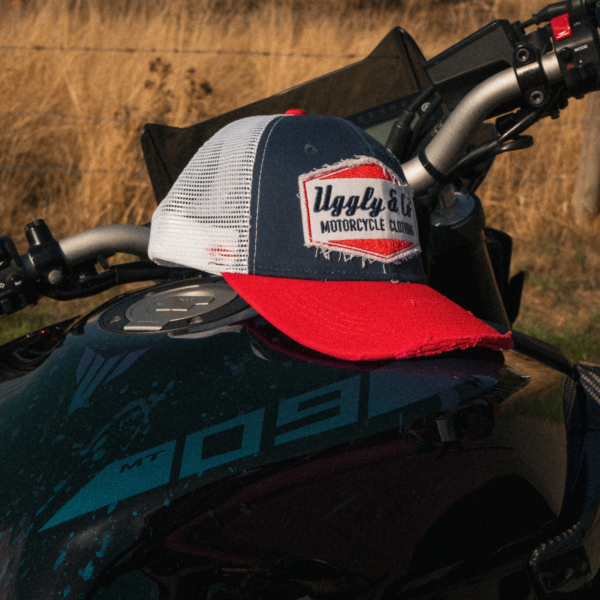 Close up of the Diamond logo on the Blue and Red Trucker Hat
