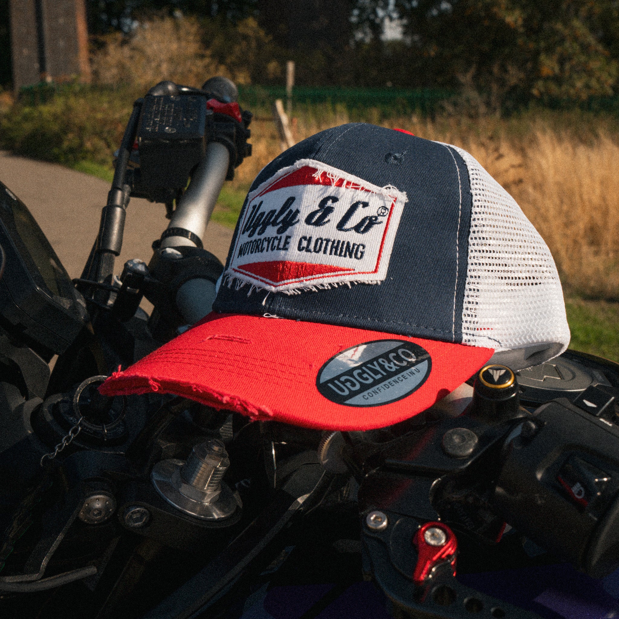 Blue and Red Diamond Trucker Hat styled in a motorcycle lifestyle setting